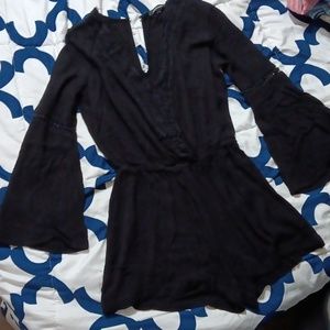 Sexy! Black v-neck romper with bell sleeves,  keyhole back, & embroidery design
